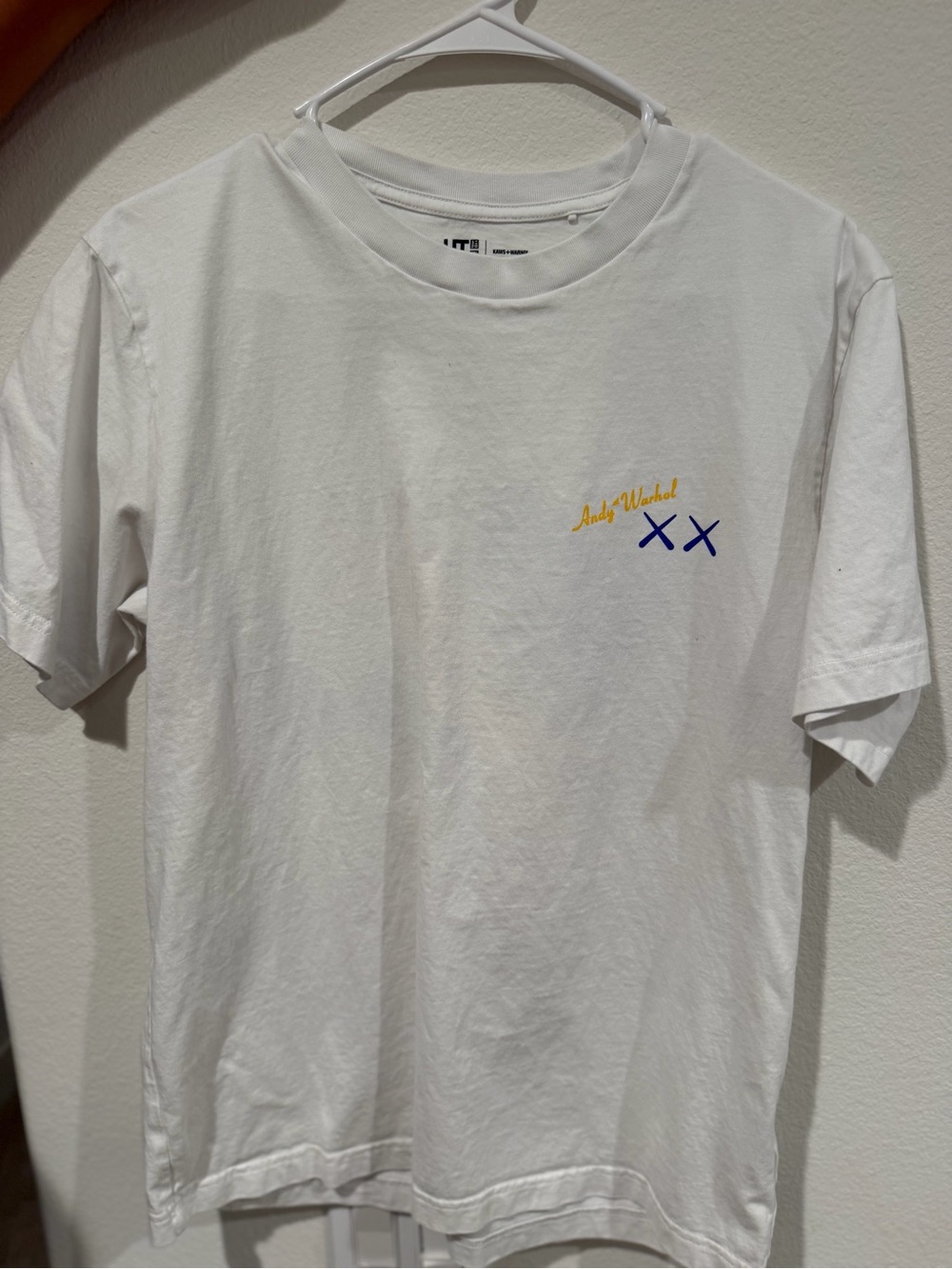 KAWS White Short Sleeve Tee with Yellow Script and Blue XX Detail